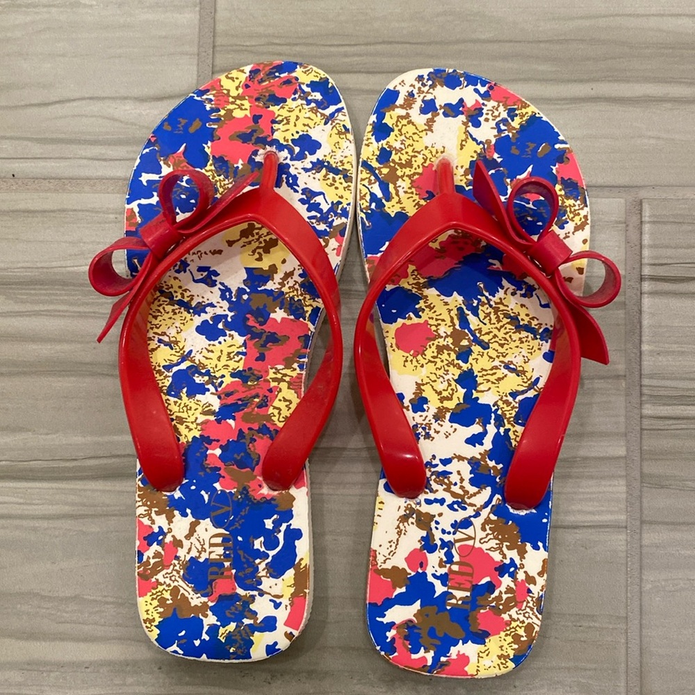 Red Valentino jelly and rubber flip flops.